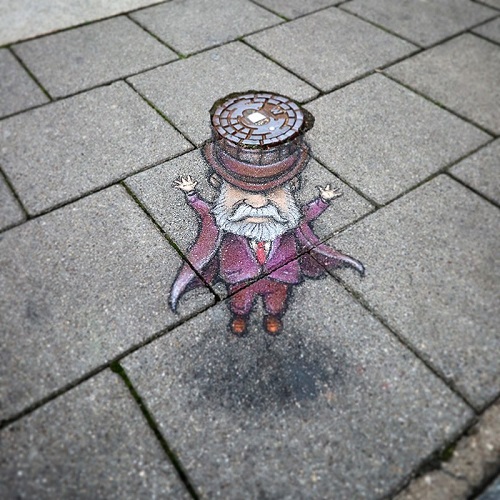 Rysunek Davida Zinna, studzienka kanalizacyjna jako street art. Przez take studzienki wykonujemy na prace WUKO polegające na czyszczeniu kanalizacji